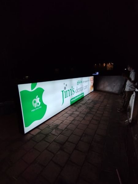 Backlit glow sign board illuminated at night for a shop front in Chennai