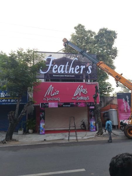 3D channel letter signage with LED lighting installed on a corporate building facade in Chennai